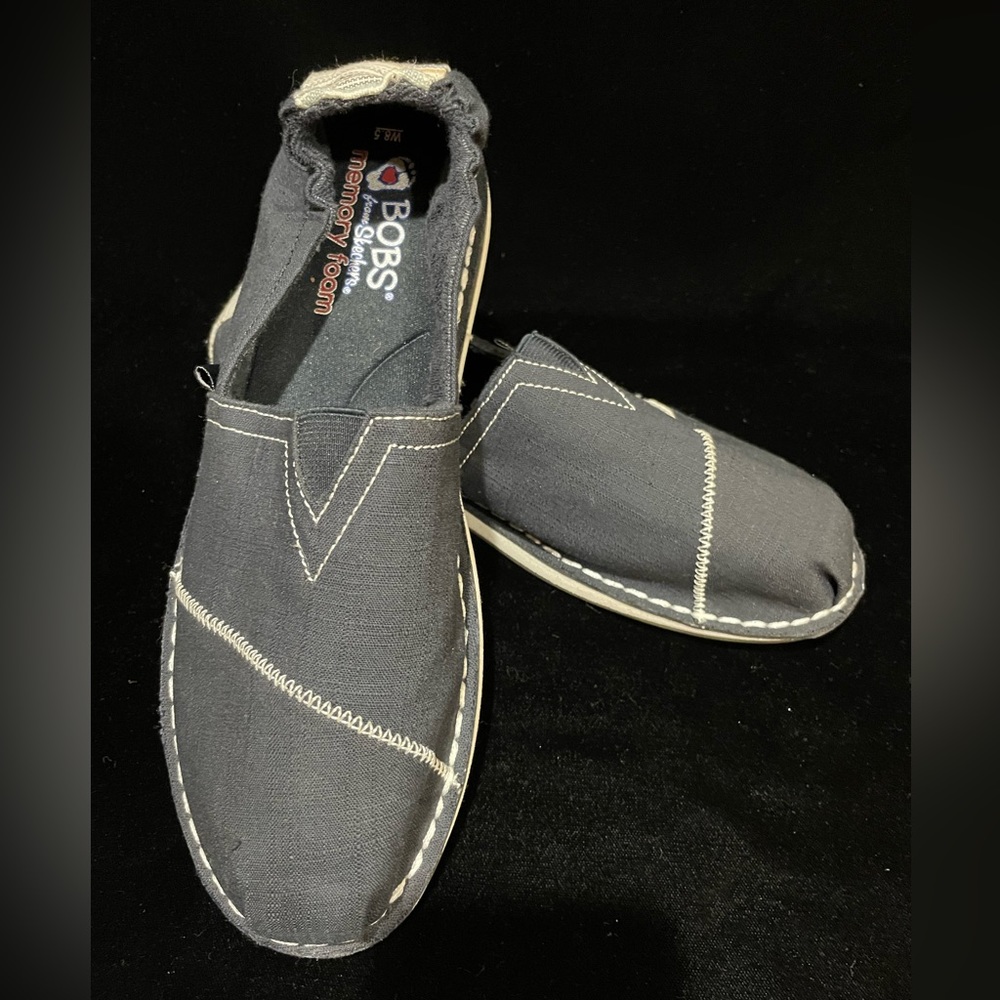 NWOT BOBS by Sketchers.  Black canvas flats with beige stitching.